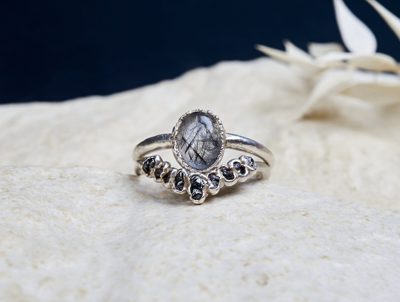 Black rutilated quartz ring set with raw black diamonds | Bernadette