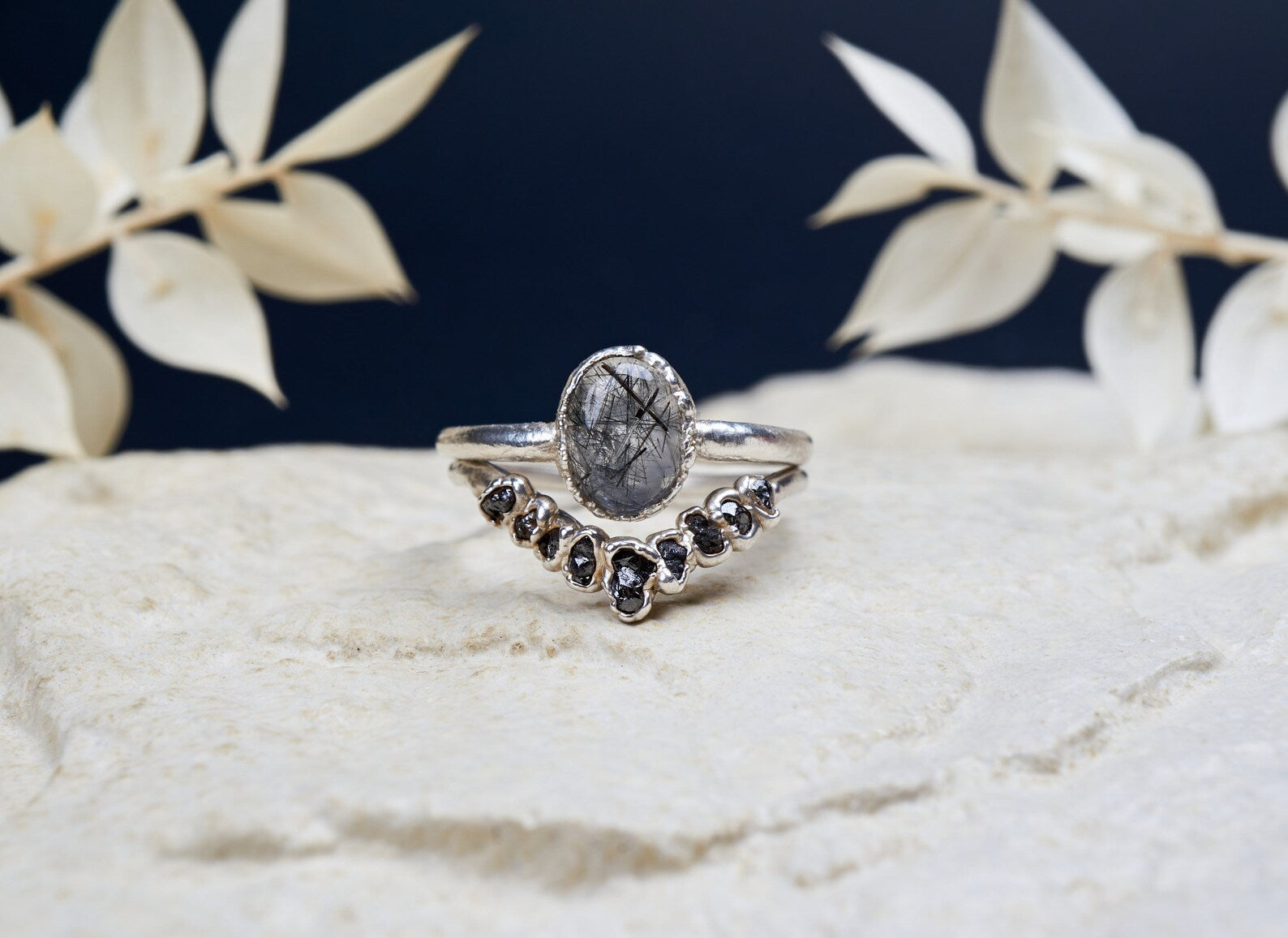 Black rutilated quartz ring set with raw black diamonds | Bernadette