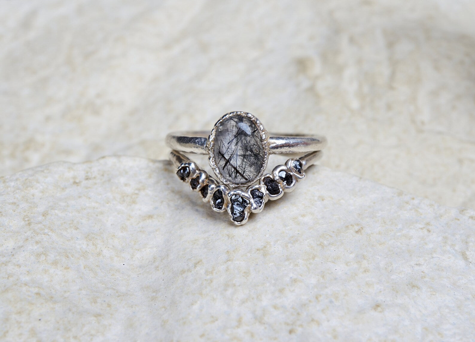 Black rutilated quartz ring set with raw black diamonds | Bernadette